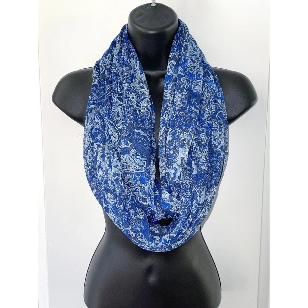 Beautiful blue infinity scarf featuring an intricate white & light-blue paisley